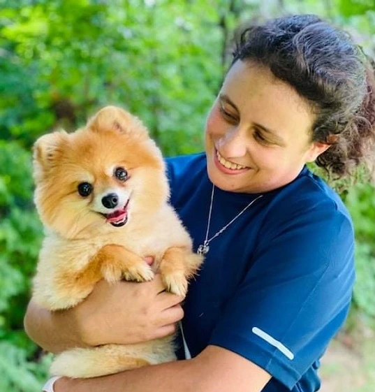 Nicole holding the happy Pomeranian Lilly